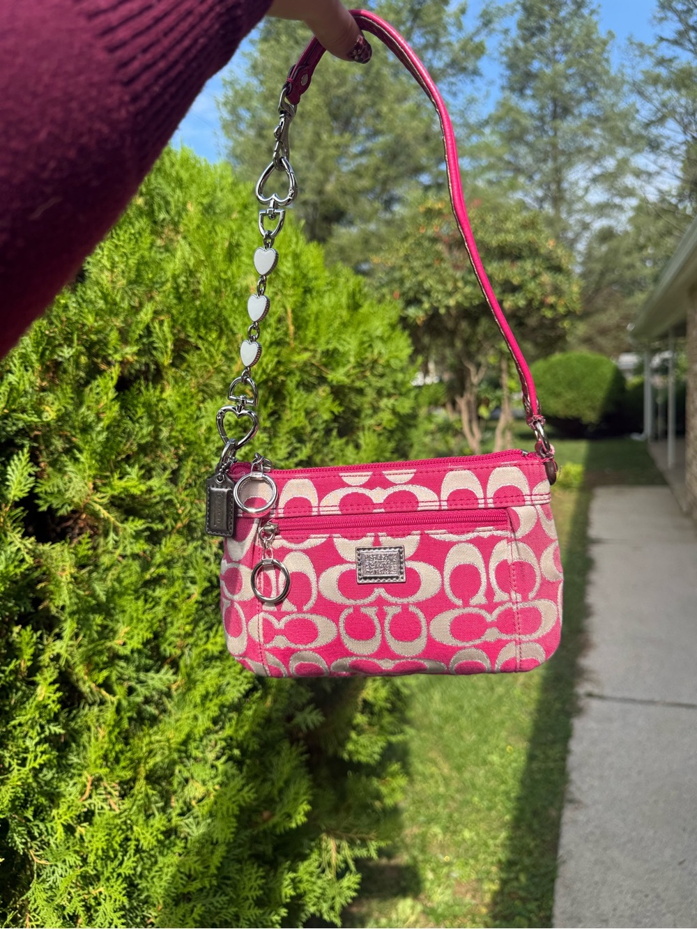Coach Pink poppy Signature Canvas mini bag with Heart Charm Strap